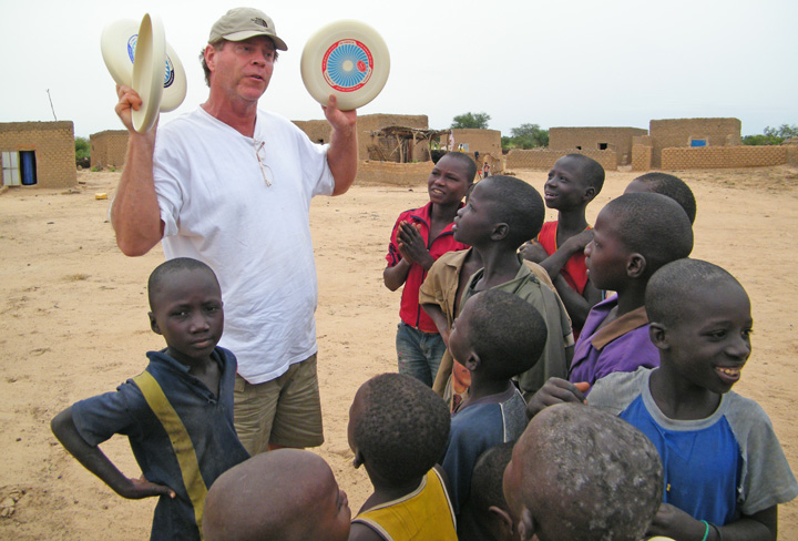 Will with frisbees in the village